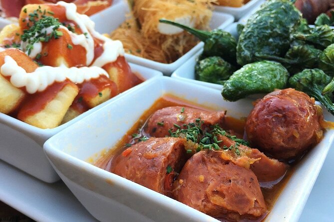 Barcelona Food Tour: Tapas, Drinks and Delights with a Local - Carrer del Regomir and Barcelona’s Familiar Favorites