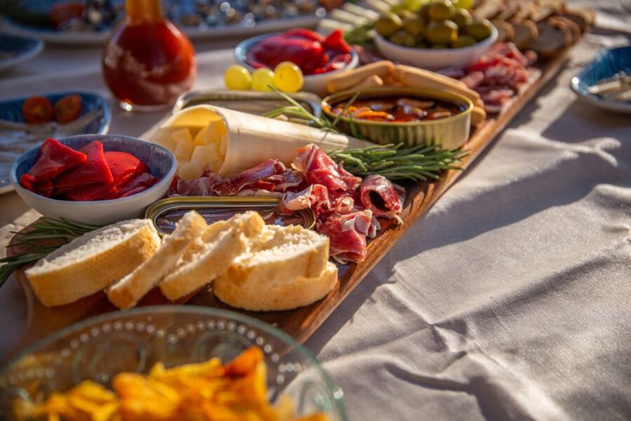 Barcelona: Local Tapas and Drinks Sailing Adventure Tour - The tapas spread: seafood, charcuterie, and simple accompaniments