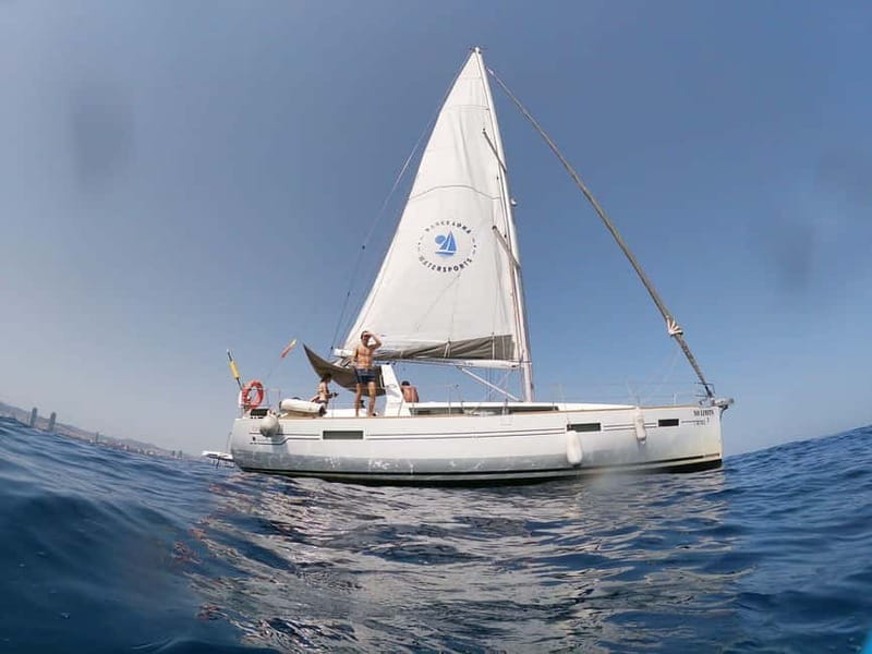Barcelona: Sailing Tour with Tapas, Drinks and Swim Stop - Pinchos, cold cuts, and two drinks onboard