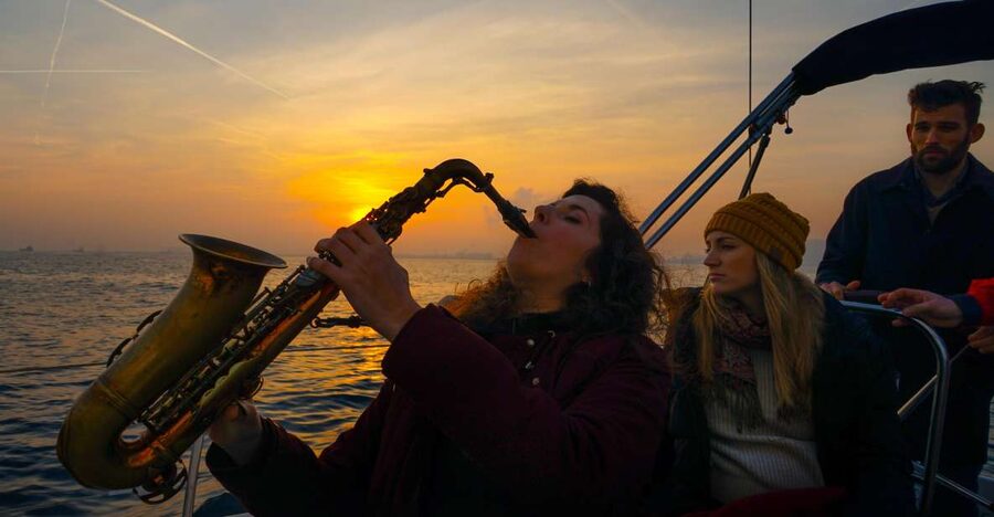 Barcelona: Sunset Live Sax and Sailing Experience with Tapas - Setting off from Port Olimpic on Bombon