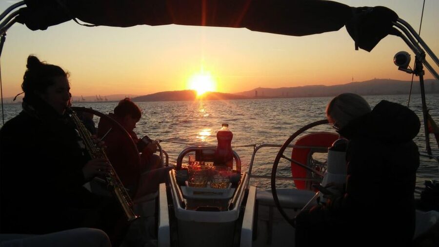 Barcelona: Sunset Live Sax and Sailing Experience with Tapas - Watching Barcelona change color from the sea