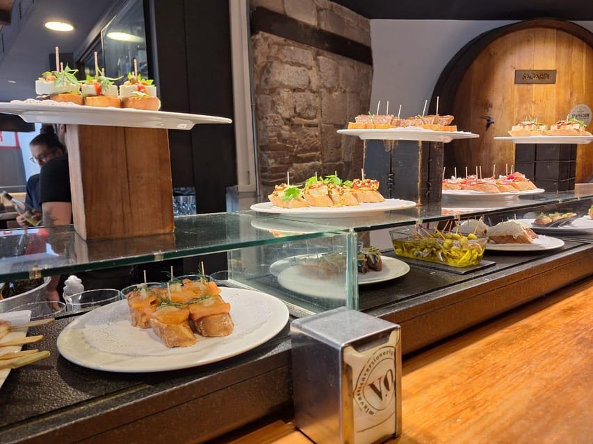Barcelona: Tapas and Pintxos Tour with Crema Catalana - Barcelona by small plate and local bar