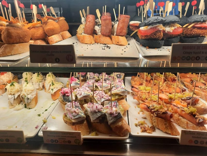 Barcelona: Tapas and Pintxos Tour with Crema Catalana - The first stops: tapas with a local accent