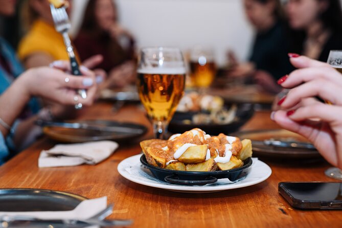 Barcelona Tapas Food Walking Tour with Wine in El Born - Starting at Plaça de Correus with Barcelona on the menu