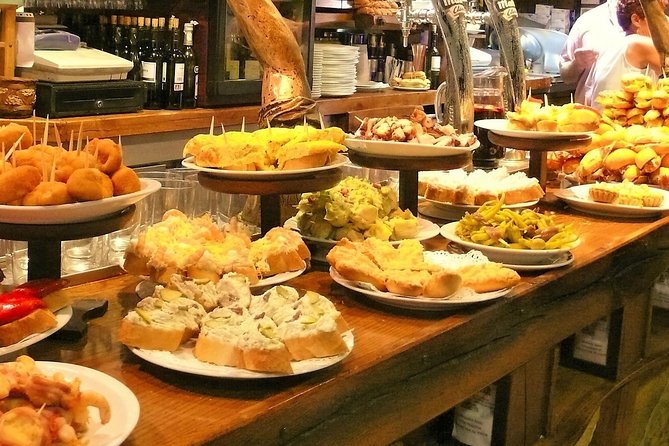 Boqueria & St Caterina Markets with Food & Tapas Small Group Tour - Walking through Barcelona’s Old Town
