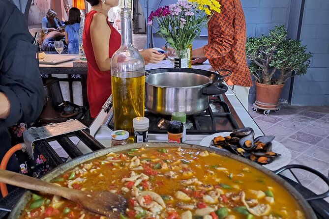 Catalan Paella Cooking Class with Small Group in Barcelona - The hosts make the evening