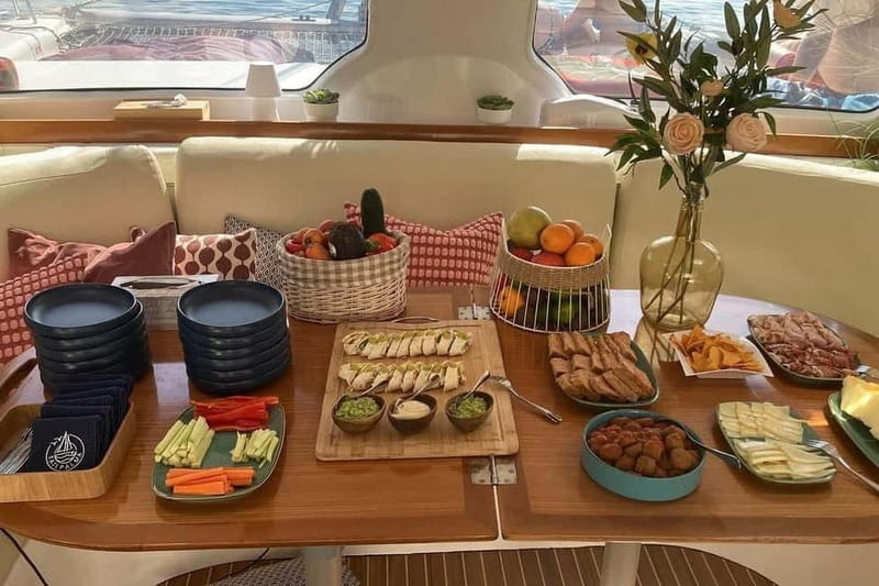 From Palma: Luxury Catamaran Group Tour with Tapas & Drinks - The swimming stop in clear Mediterranean water