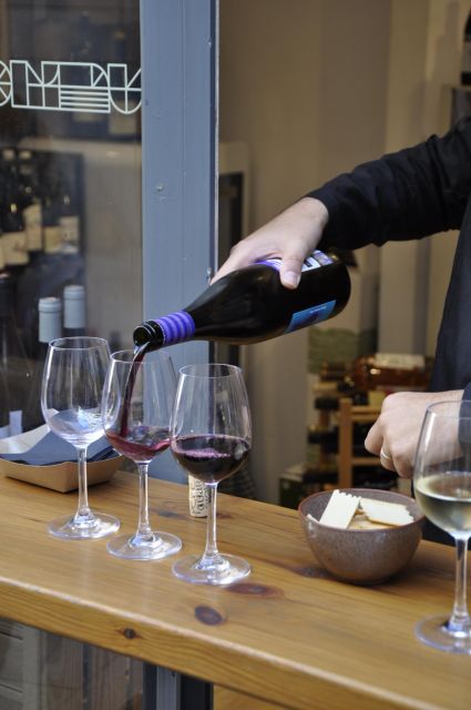 Girona Evening Food Tour & Tapas Bar Experience - Cheese and wine on Carrer de les Ballesteries