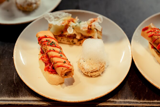 Gourmet Pintxos & Premium Wines small groups Food Tour - Moving into Plaza Nueva and Las Siete Calles