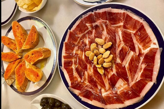 Half Day Private Madrid Tapas and History Walking Tour - Stop two: Asturian cider in the Literary Quarter