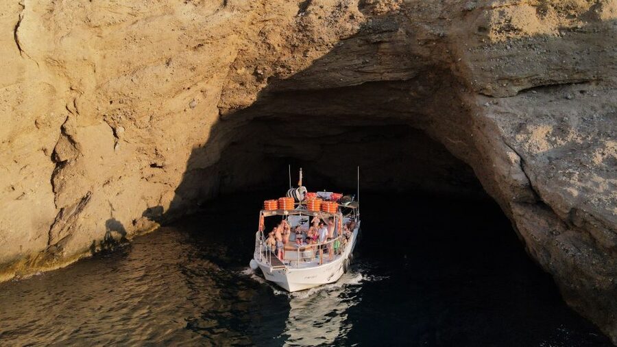 Ibiza: Scenic Cruise with Tapas and Drinks - Leaving San Antonio and crossing the bay