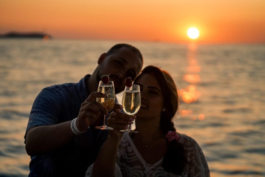 Ibiza: Secret Coves Guided Boat Tour with Open Bar and Tapas - Tapas, fruit, and an open bar at sea