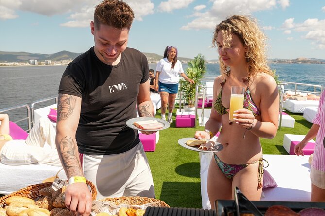 Ibiza to Formentera Cruise with Snorkeling, Paella & Open Bar - Paella, fruit, and the open bar
