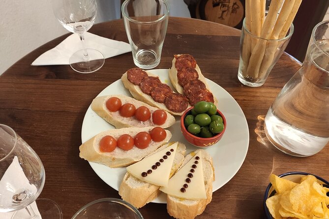 Indulge in Cordoba: Local Wines & Tapas Tasting - Tapas that keep the tasting grounded