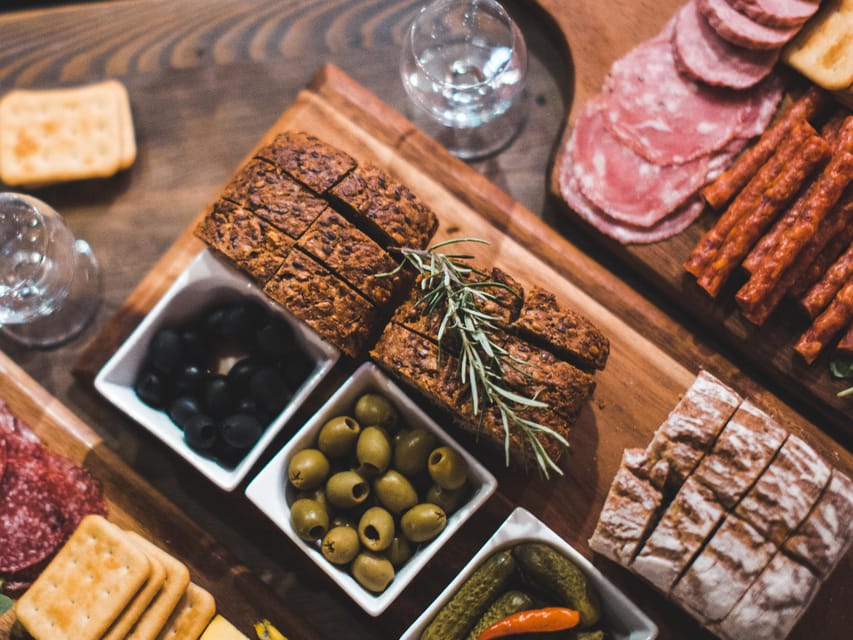 Krakow: Vodka Tasting Tour: Tapas, Tipsy Tales & Hidden Gems - Old Town streets and small bar doors