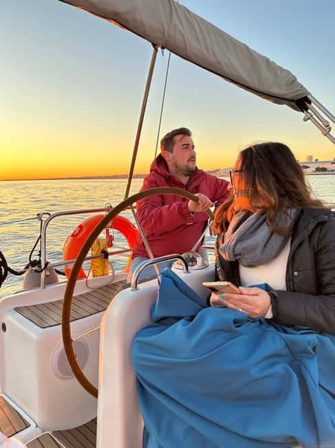 Lisbon: Romantic Cruise with Wine & Portuguese Tapas - Under the 25 de Abril Bridge