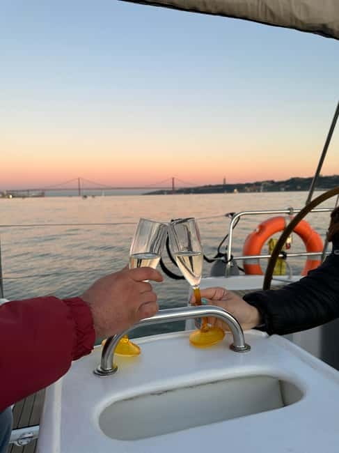 Lisbon: Romantic Cruise with Wine & Portuguese Tapas - The central waterfront: Time Out Market to Commerce Square