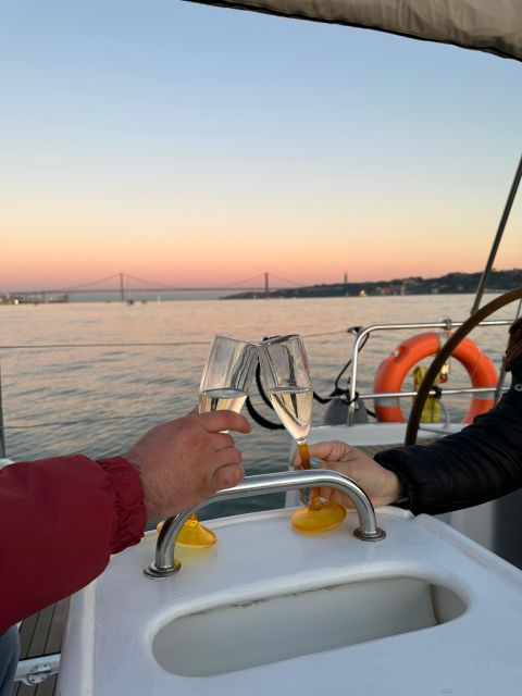 Lisbon: Romantic Cruise with Wine & Portuguese Tapas - Crossing toward Christ the King