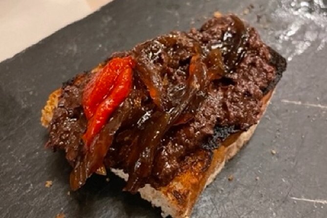 Madrid by Night Small Group Tour: Stories, Sights and Tapas Bites - The first bar: your included introduction to Spanish tapas