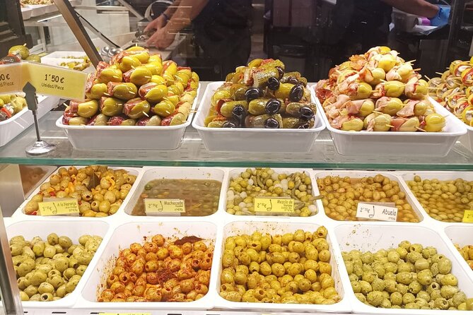 Madrid Food Tour: Tapas, Drinks and Delights with a Local - Madrid cold cuts near the Mingote mural