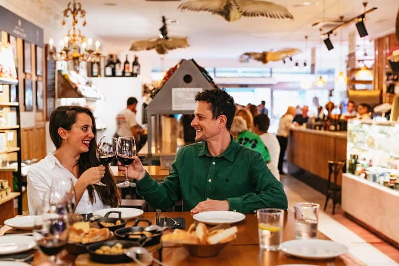 Madrid: Guided Tapas and Wine Tour with Rooftop Views - Four hours of Madrid, one plate at a time