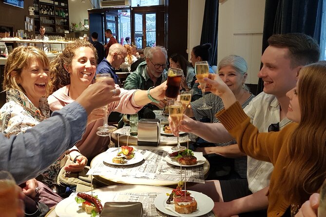 Madrid History Food Tour: Tapas & Drinks Tasting - Garlic shrimp, eggplant, and patatas bravas