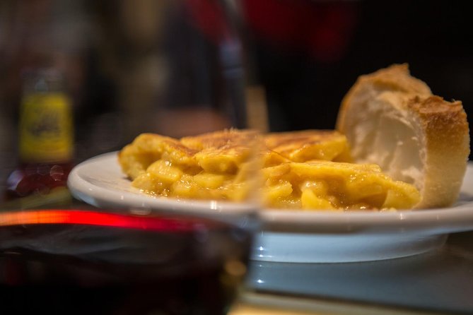 Madrid Local's Wine and Tapas Lunch Tour with a side of History - Starting with wine and croquetas at Plaza Isabel II