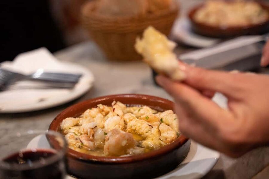 Madrid: Local Tapas, Drinks, and Hidden Gems Walking Tour - Plaza Mayor and the squid sandwich