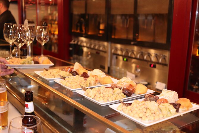 Madrid Small Group Tapas Tour at 4 Venues -Lunch or Dinner - Guides, group size, and the pace of the evening