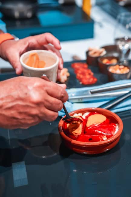 Madrid: Tapas Cooking Class with bottomless Wine Pairing - Cooking five tapas instead of watching a demonstration