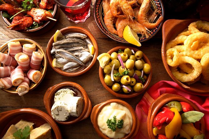 Madrid Tapas Experience Walking Tour - Learning the wineskin and Asturian cider traditions
