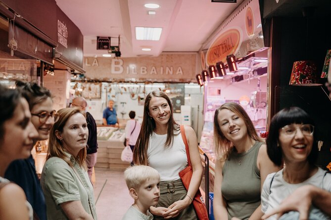 Madrid Tapas & Paella Cooking Experience with Local Market Visit - Sitting down to the meal