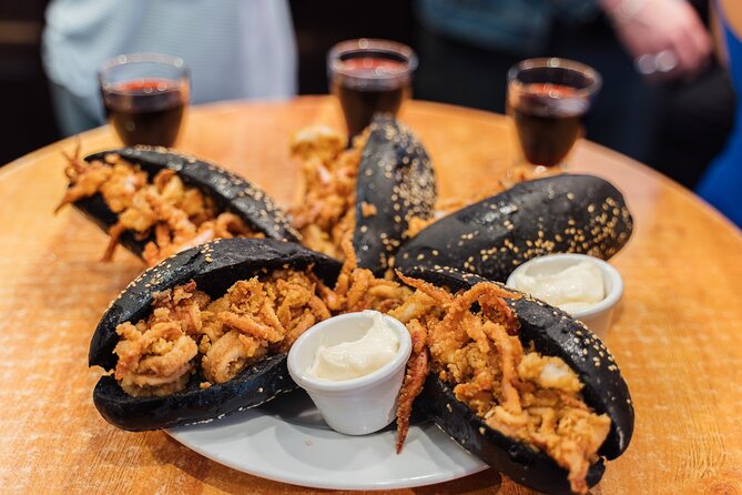 Madrid: Tapas Walking Tour with Food and Drinks Included - Calle de Toledo and the squid-ink sandwich