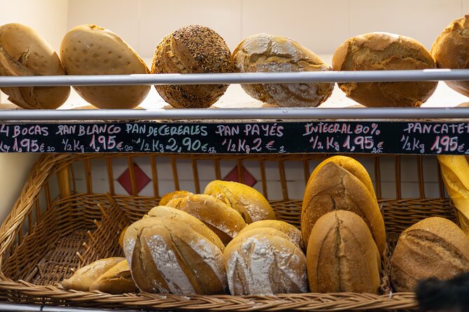 Malaga Food Tour with 12+ Tastings: Tapas, Olive Oil, Ham & More - Finishing by the Roman Theatre