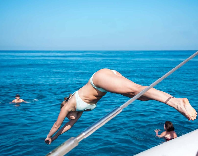 Malaga: Sailing Catamaran with Swimming and Paella Lunch - Leaving Malaga by Catamaran