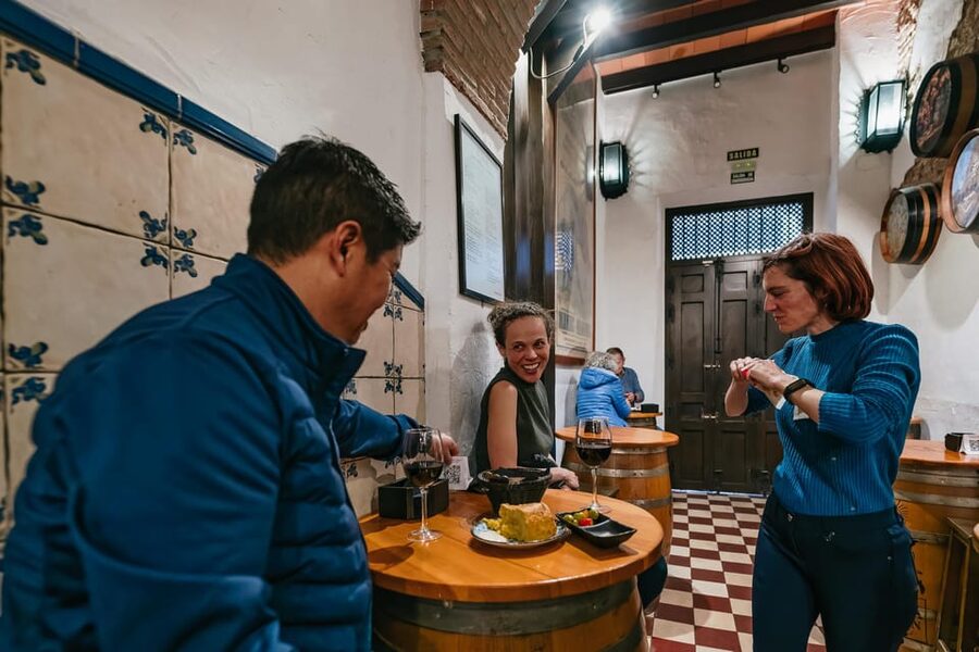 Málaga: Traditional Andalusian Tapas and Wine Tour - Stop two: A local restaurant with substantial tapas