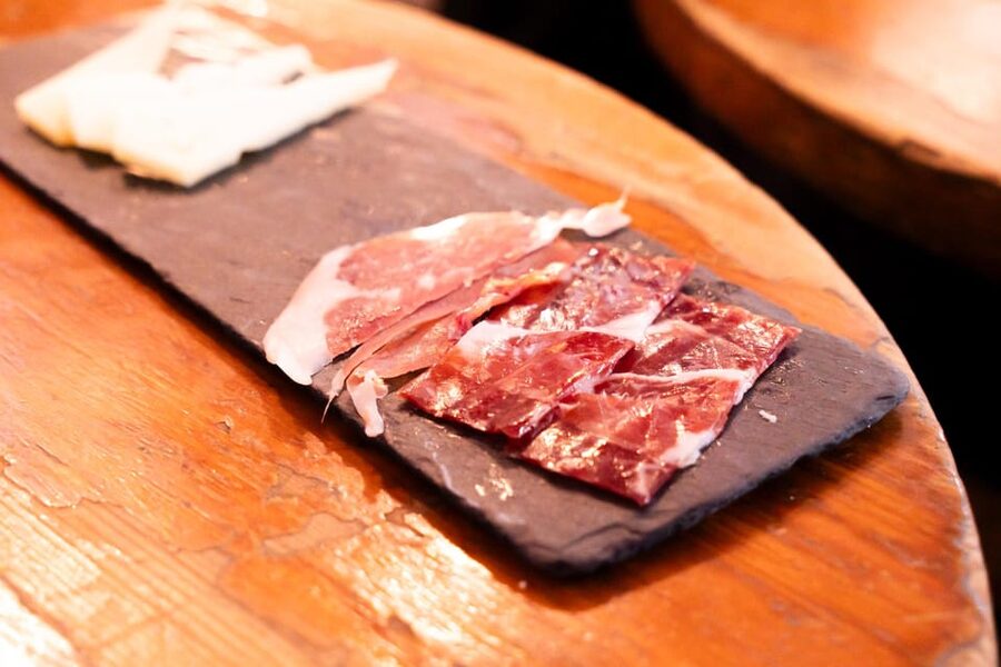 Malaga: Wine and Tapas Tour with Tastings and Drinks - Second stop: Malaga’s old wine-canteen atmosphere