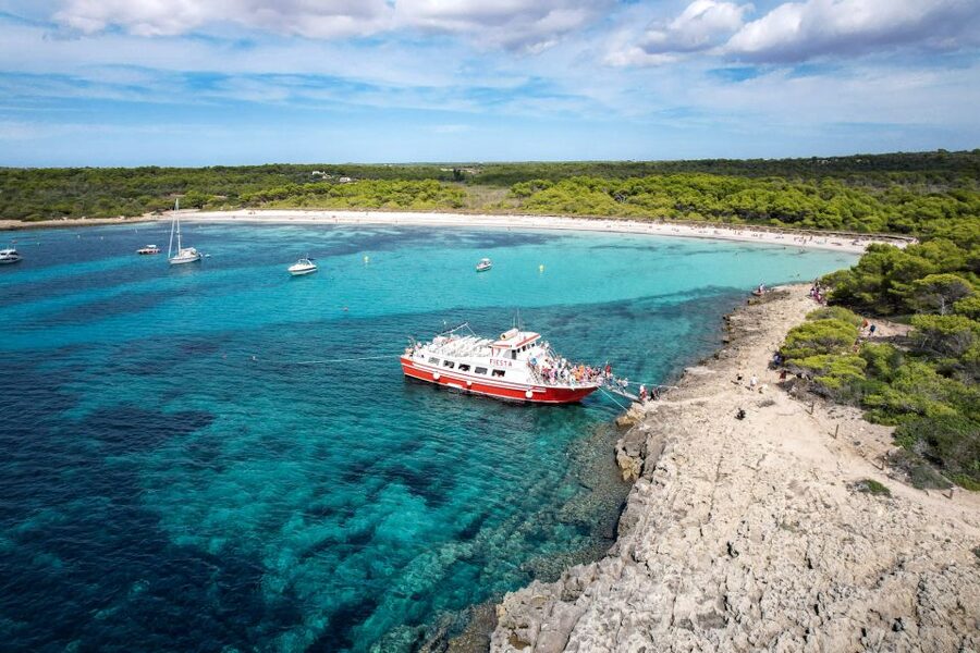 Menorca: Full-Day Boat Tour with Paella Lunch - Leaving Ciutadella on the red Fiesta boat