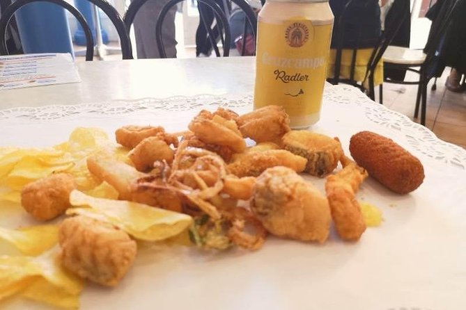 Morning Walk with Breakfast, Market tastings & Authentic Flavoured Tapas Lunch - Crossing the Triana Bridge
