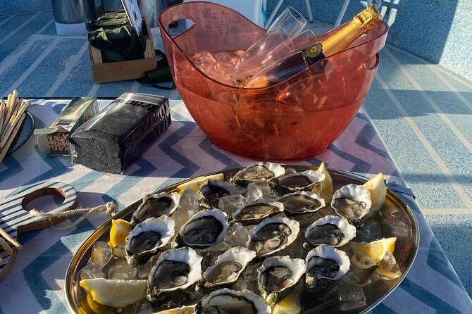 Olhão: Private Boat Tour, at Sunset with Oysters/Tapas and Drinks - Olhão, Farol, and the island chain