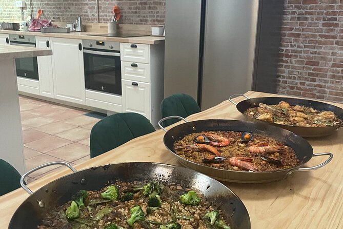 Paella and Burnt Basque Cheesecake Cooking Class (in Bilbao) - Sitting down to eat everything you prepared