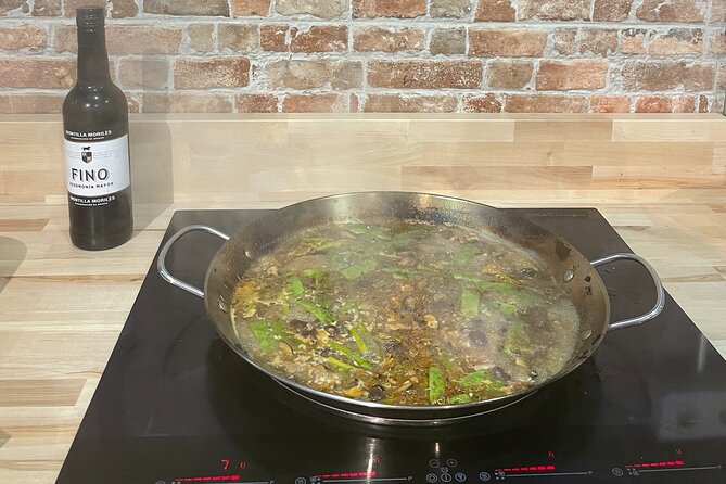 Paella and Burnt Basque Cheesecake Cooking Class (in Bilbao) - Preparing chicken, shrimp, and bomba rice for two paellas
