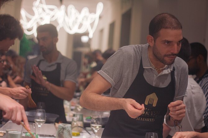 Paella Cooking Class in Madrid with Bottomless Wine Pairing - Cooking paella in pairs at The Cooking Clubhouse