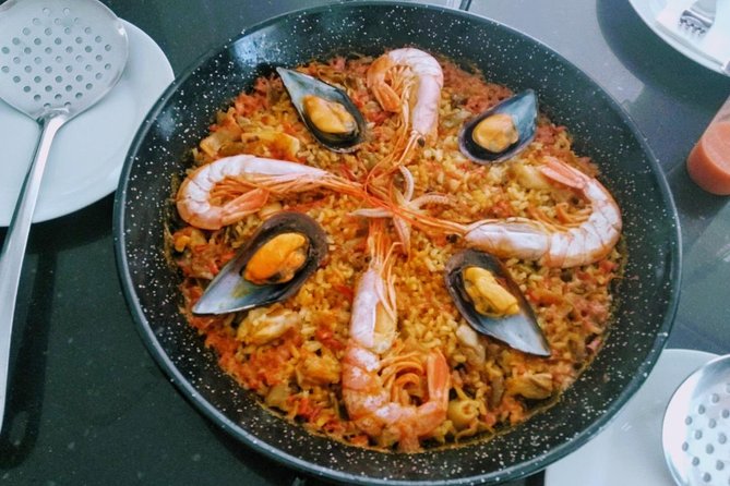 Paella Cooking Class in Malaga - Sit down to paella with wine, beer, and fruit