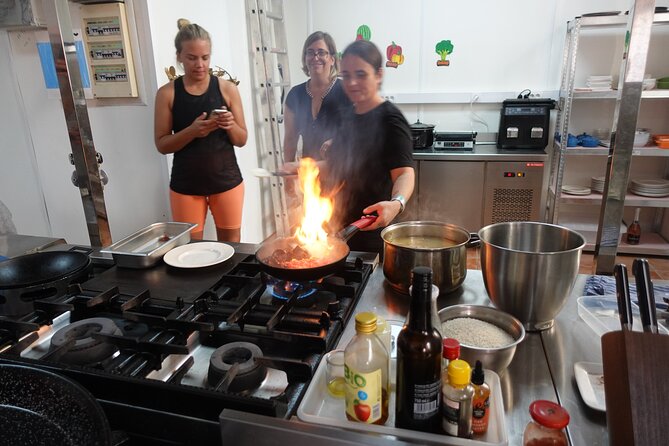 Paella & Sangria Class with Tapas and Market Visit - Walking from the market to the kitchen