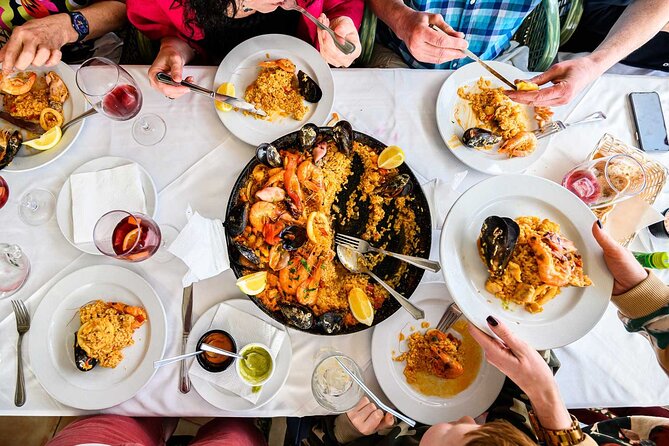 Paella Workshop with Bottomless Sangria in Central Madrid - Preparing the shared chicken and seafood paella