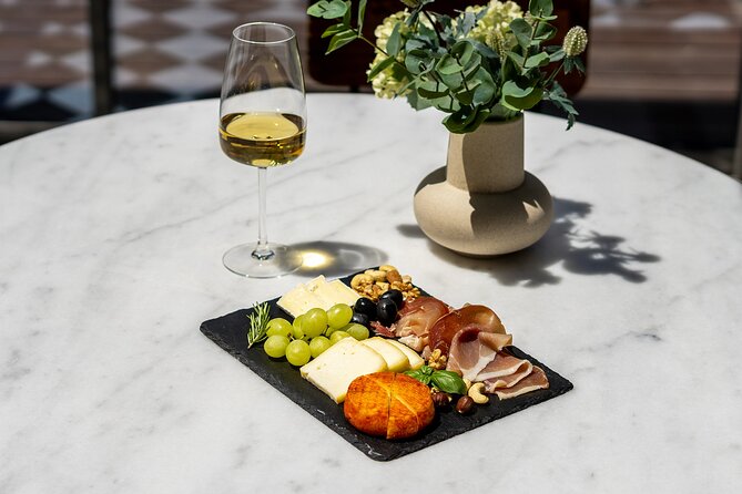 Porto Wine Tasting Experience with Portuguese Tapas Plate - Cheese, ham, crackers, and jam are part of the lesson