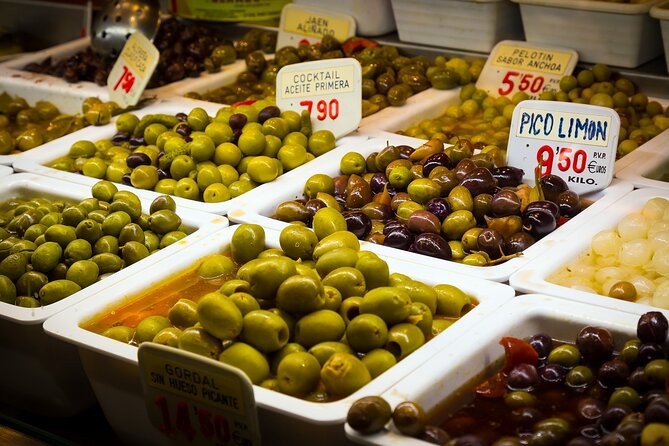 PREMIUM TAPAS TOUR: Paella, Market Tastings, and Winery - Reading Malaga’s food stalls at Atarazanas Market