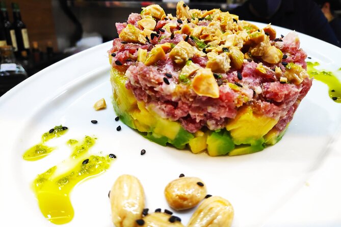 PREMIUM TAPAS TOUR: Paella, Market Tastings, and Winery - Paella near the Cathedral and Picasso Museum