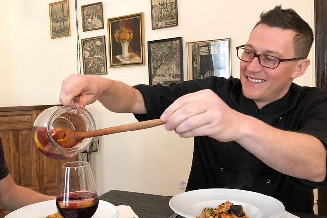 Private Authentic Paella Cooking Class in Barcelona with Josh - Sitting down in an 18th-century-style dining room